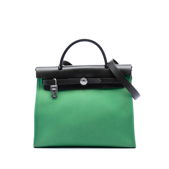 Hermes Handbags - Pre-Loved Hermes Military Toile and Vache Hunter Herbag Zip 31